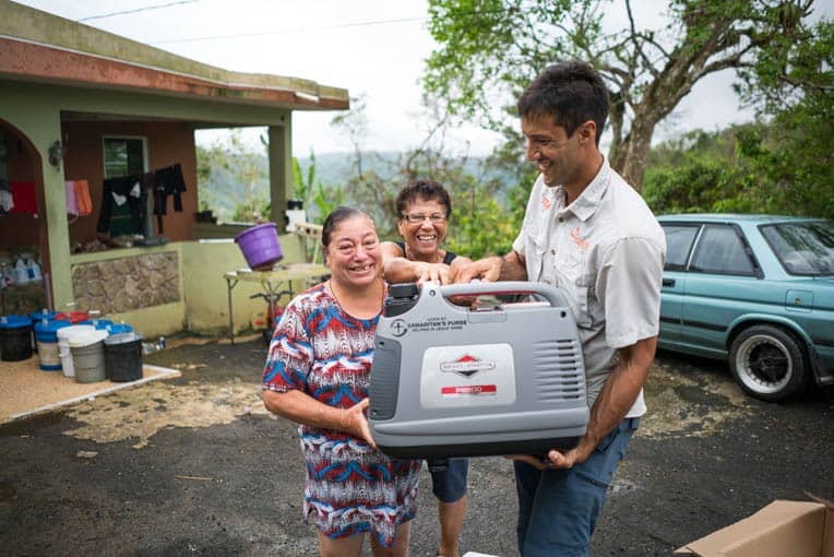 Blanca Judith Colon (at left) received a generator from Samaritan’s Purse to help her care for her disabled son. Her aunt, Elsa, is at center, and Andres Morales is at right.