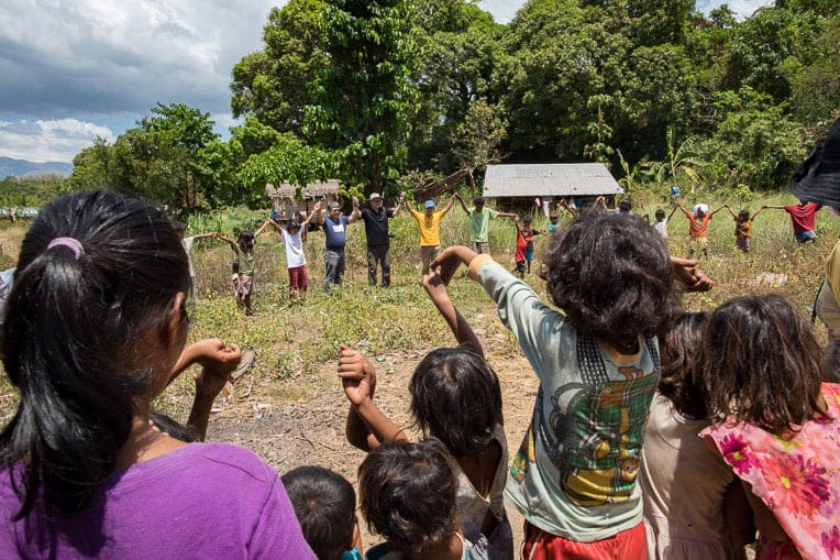 The village participated in a prayer and dedication service on the site where the church building will be constructed.