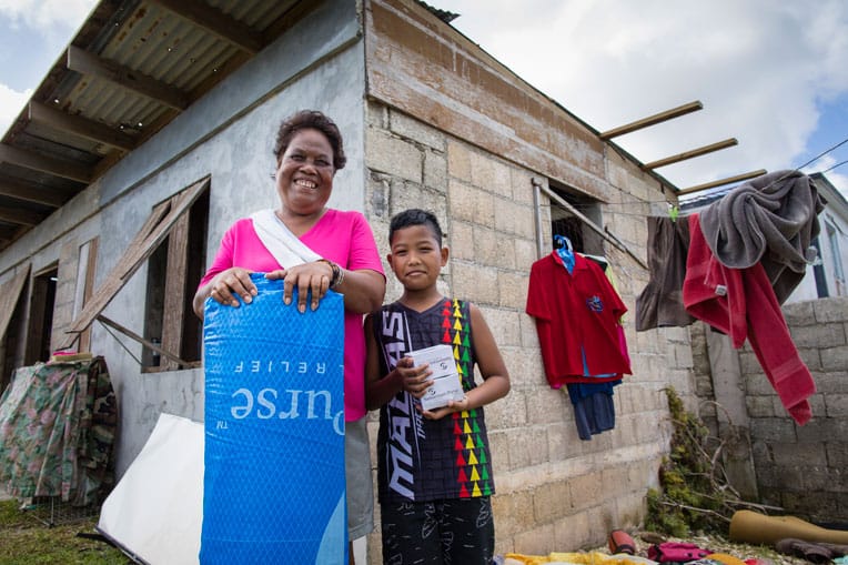 The roof on Rosa and Tony's home was blown off during the typhoon, flooding their home with heavy rain.