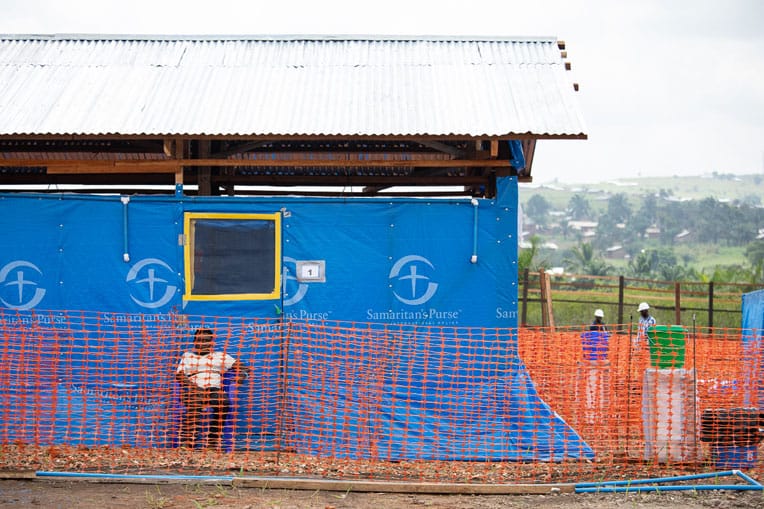 Kavoro (seated) was the first patient in our Ebola Treatment Center.