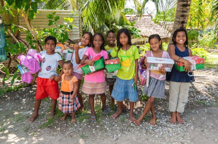 Children gather to celebrate the new gifts they've received. These boys and girls not only received special presents but also an opportunity to hear the Gospel of Jesus Christ.