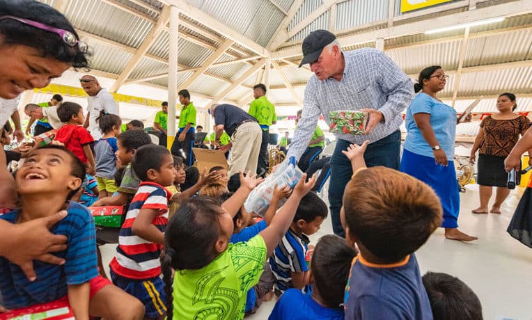 Samaritan's Purse President Franklin Graham hands out Operation Christmas Child shoebox gifts in the Pacific Island nation of Kiribati.