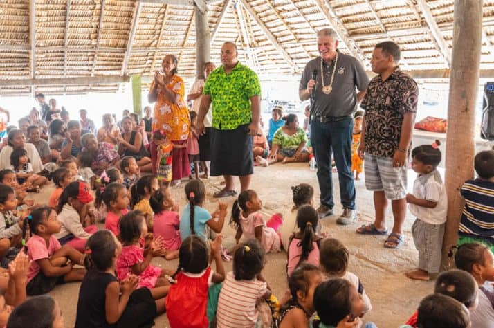 Franklin joins church leaders talking with children during one of many outreach events on Tarawa.