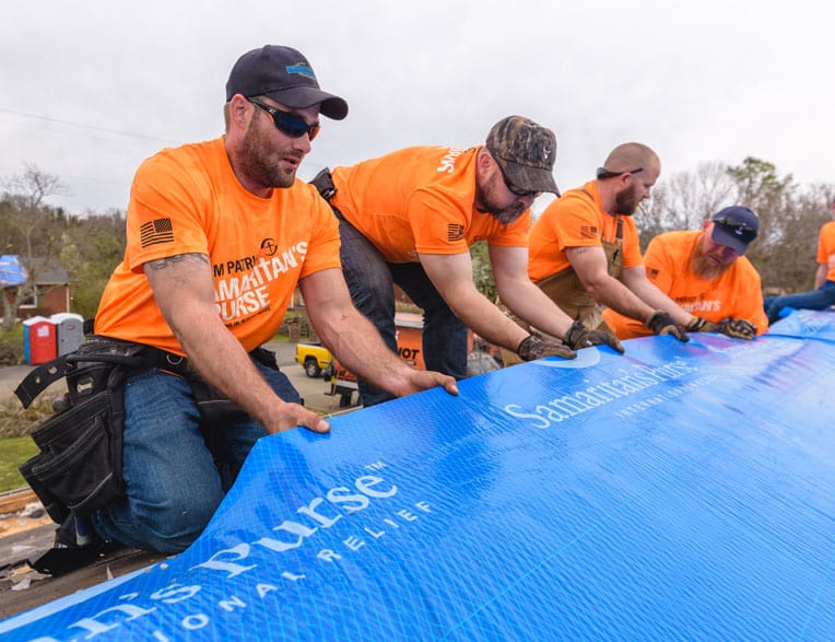 Team Patriot tarps a roof in Cookeville, Tennessee.