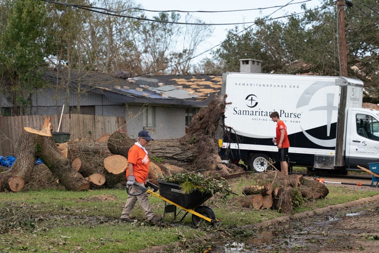 Volunteers are clearing trees and yard debris across southern Louisiana.