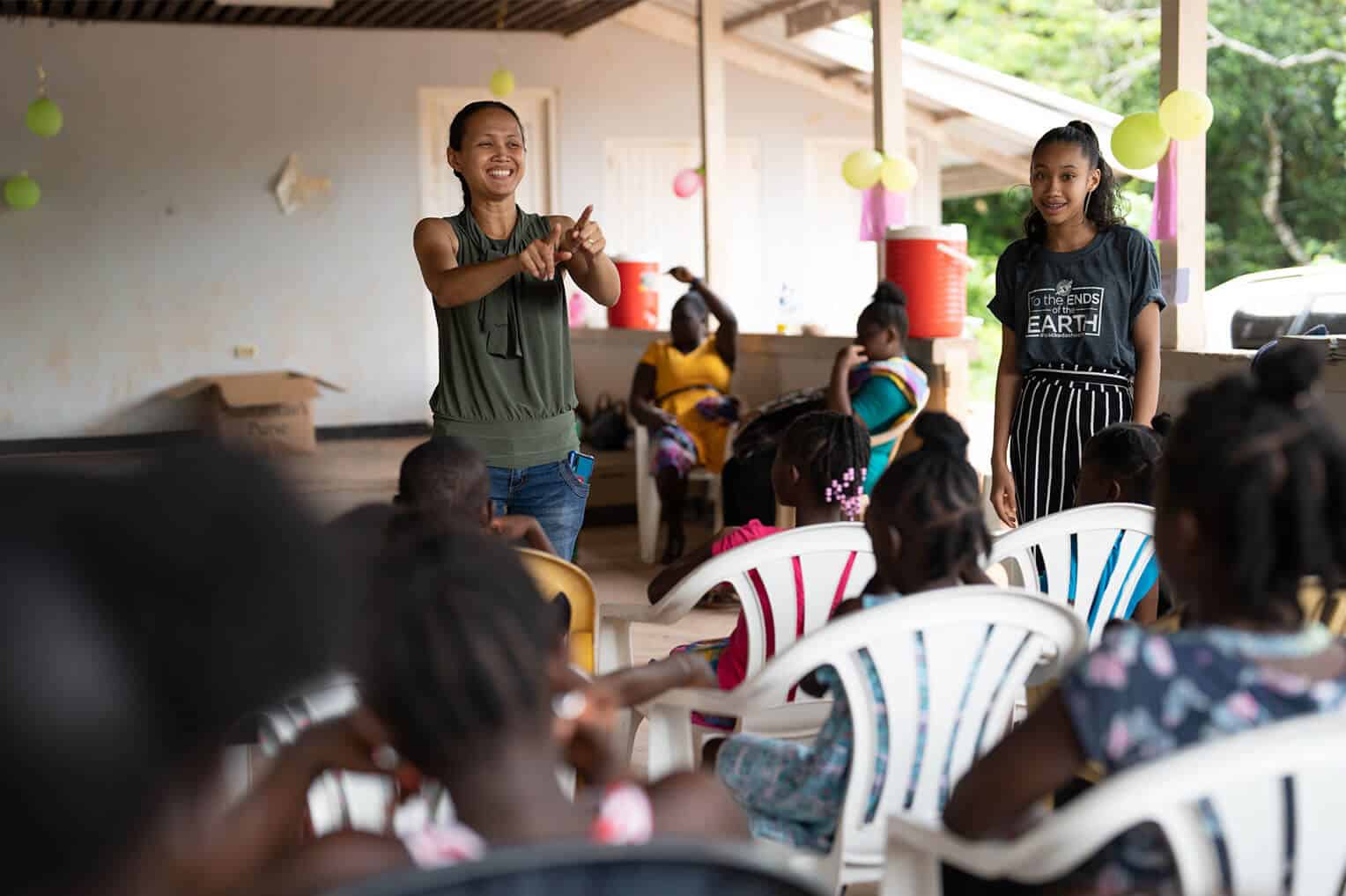 Charahja (right) and her mother (left), Abigail, teach the first lesson of The Greatest Journey together in Suriname.