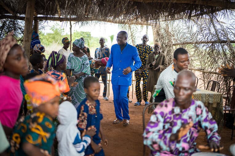 Among those village leaders is Ogouleroun, pictured back right, who now worships his King Jesus.