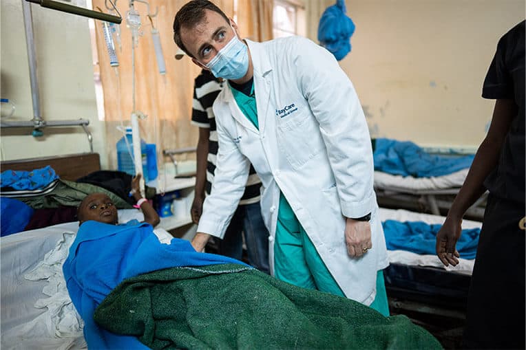 A Tenwek Hospital patient receives care from Dr. Fitzwater.