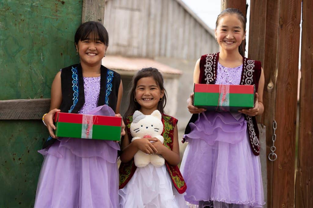 Emina (left), Medina (right), and their little sister Adina*, 6, all received shoebox gifts from Good News Church.