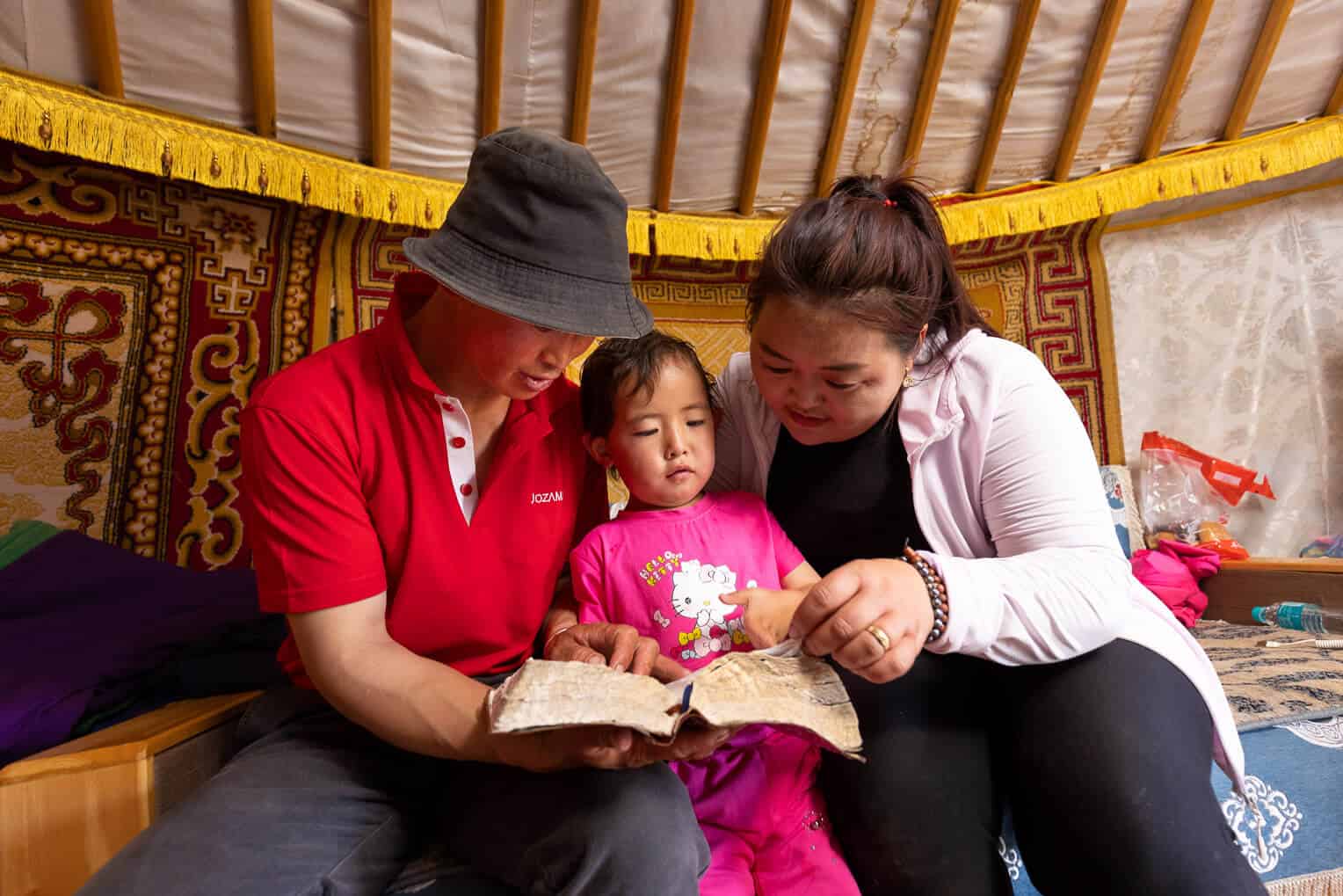 Baljinnyam teaches his family to follow the Bible.