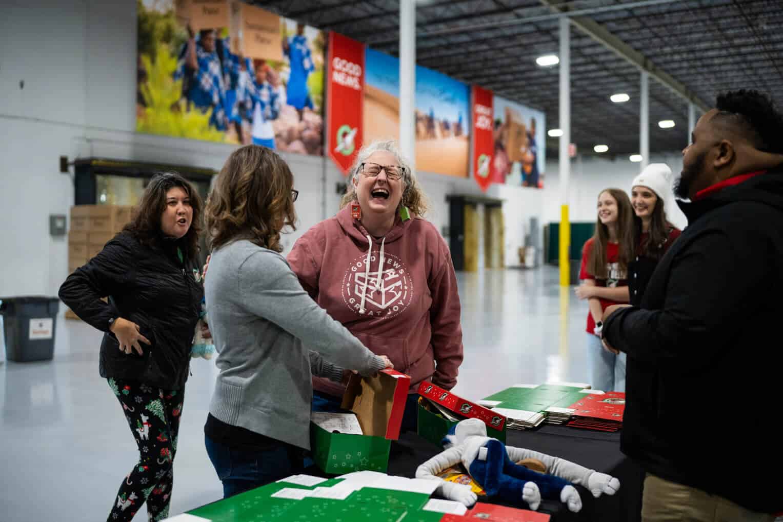 Packing teams enjoy a friendly packing competition at our Aurora processing center (Midwest Ministry Center).