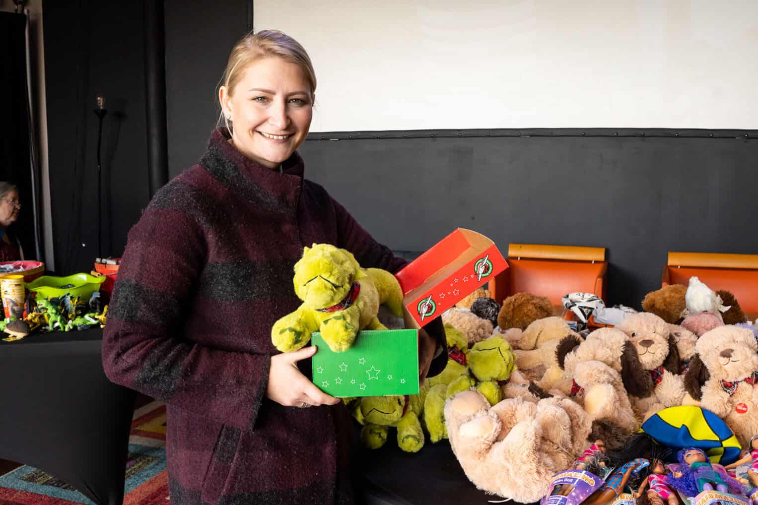 Elizabeth help pack shoeboxes in Franklin, Tennessee.