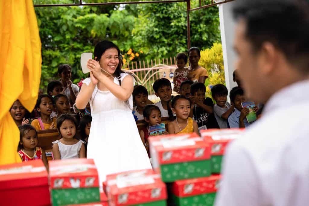 Mercy leads an Operation Christmas Child outreach event in her village.