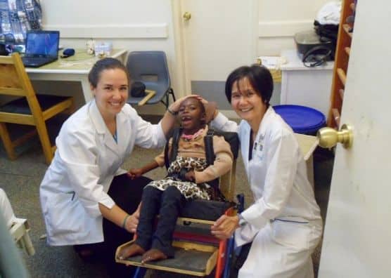 Betty Cheung and girl with cerebral palsy