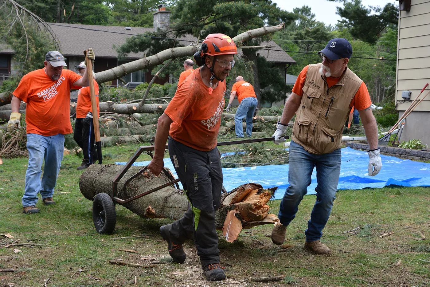 Disaster relief volunteers clearing storm debris