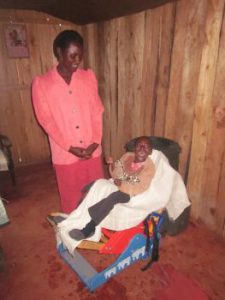 Diana in her chair with mother standing