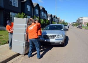 Samaritan's Purse volunteers move fridge
