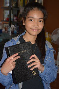 Grace holds Bible