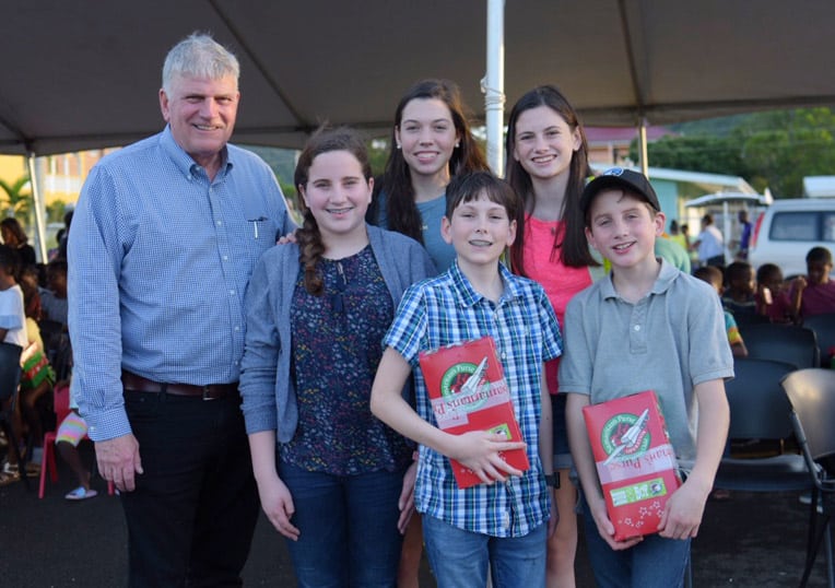 Franklin Graham with the grandchildren who accompanied him to shoebox distributions in Antigua.