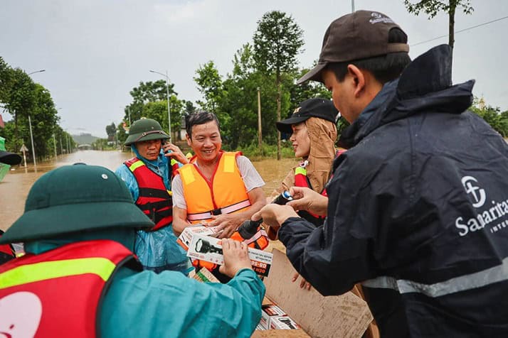 Samaritan's Purse staff distributes lifejackets, flashlights, and whistles to residents in the Yen Bai province of Vietnam just days after Typhoon Yagi made landfall.