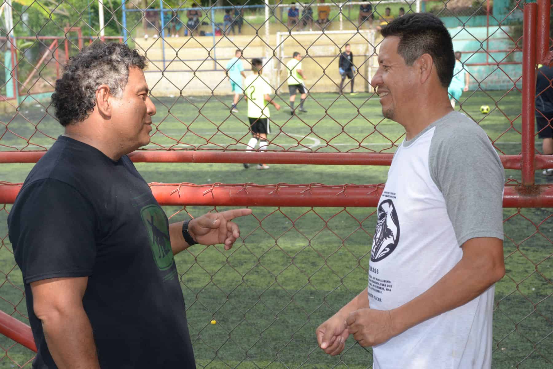 Jose Victor Dominguez (left), who operates our community development programs in El Salvador, speaks with Carlos Cruz, who oversees a Samaritan's Purse-sponsored soccer league.