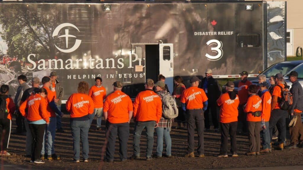 Early each morning, volunteers gather near our Disaster Relief Unit tractor trailer to pray before heading out to serve in Jesus’ Name. 