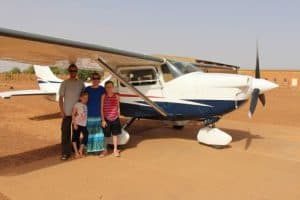 Penney family next to bush plane