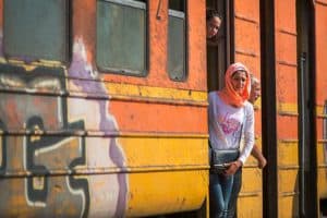 Refugee at door of transit vehicle