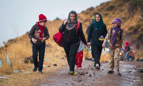 Family of refugees walking