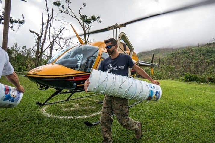 Samaritan's Purse staff member Ricky Geigel unloads relief supplies for a remote mountain community in Puerto Rico.