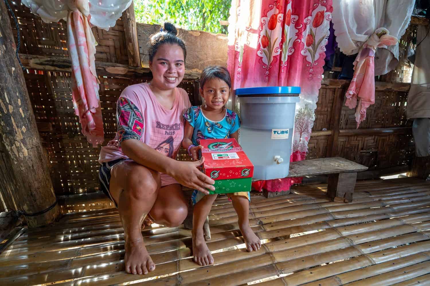 In addition to water filters, Pastor Alexis delivered Operation Christmas Child shoebox gifts and taught The Greatest Journey discipleship lessons to children in Panimbay, including Jean.