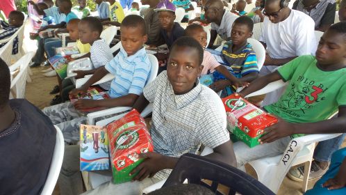 Young man in Senegal receives his shoebox