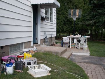 House with recovered items outside in yard