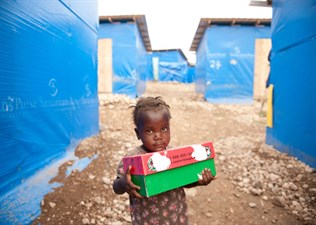 Helping rebuild in Haiti_APshoe box